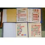 Four stamp albums containing GB and worldwide examples.