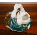 A Chinese porcelain humourous figure with gaping mouth, 10cm high.