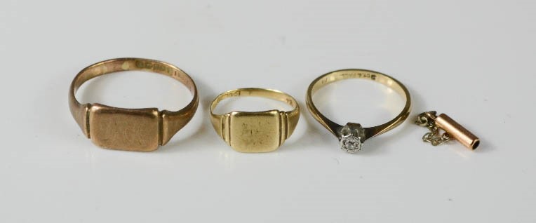 Two 9ct gold signet rings, and a solitaire ring, 7.4g total.