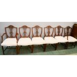 Four mahogany armchairs with shield form backs, cream upholstered seats, together with a Victorian