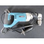 Makita electric hand drill.