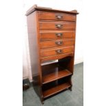 An Edwardian mahogany music cabinet.