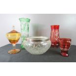 A silver and cut glass bowl, two bohemian glass vases, one in red one in green and an amber coloured