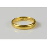 A 22ct gold wedding band, size F, 3g.