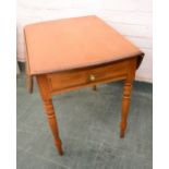 A Roger Conant Ball drop-leaf table.