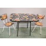 A Kitch formica table and two matching dining chairs.