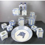 A group of blue and white Chinese hexagonal candle holders and other blue and white ceramics.