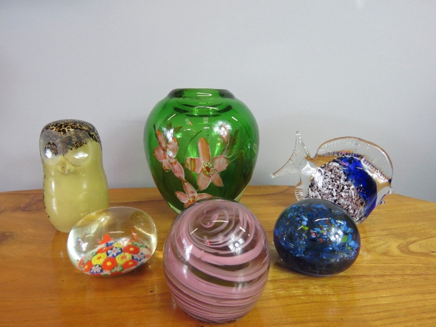 A group of paperweights; millefiori example, one in the form of an owl and a fish, together with a