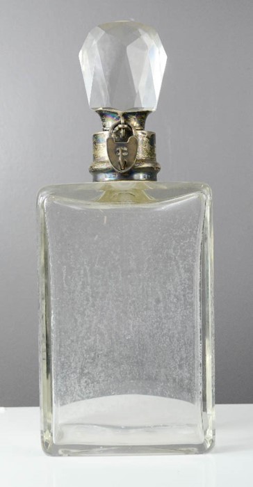 A silver and cut glass decanter, the silver collar having a 'Secure Lever' padlock and key to secure