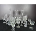 Three decanters and a group of crystal glasses, jug etc.