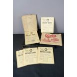 Two ration book holders and a Ministry of Food 1953-54 ration books; part complete.