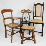 A 19th century oak stool with oval top, a Victorian caned seat chair, a mahogany side table and