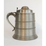 A large pewter ice bucket in the form of a tankard with raised thumb piece, 28cm high.