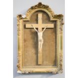 A 19th century Ivory carved corpus christi, in a giltwood frame.