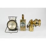 An Edwardian bicycle lamp, together with two other antique lamps.