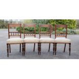 A set of four Edwardian chairs with upholstered seats.