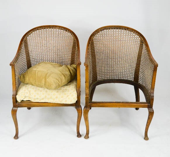 A pair of caned armchairs, A/F.