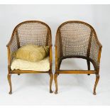 A pair of caned armchairs, A/F.