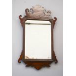 A 19th century mahogany fret carved wall mirror, 81 by 49cm.