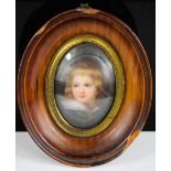 A 19th century miniature portrait of young girl, in an oval frame, 9 by 7.5cm.