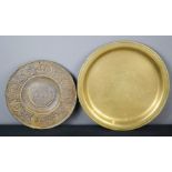 A bronze dish and a small gilt metal alms type dish, with embossed with figural panels and