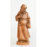 A pair of wooden carved figures, together with a wooden carved monk. (3)