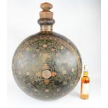 A large early Advertisement bottle, hand painted with decoration.