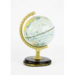 A small desk globe, 1930s, 22cm high.