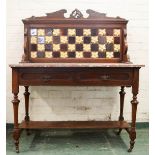 An Edwardian mahogany washstand, with a tiled back depicting orchids, and a marble top.