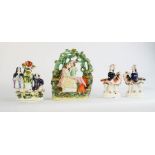 A group of 19th century Staffordshire figure groups: lovers beneath trees, a pair of girls seated