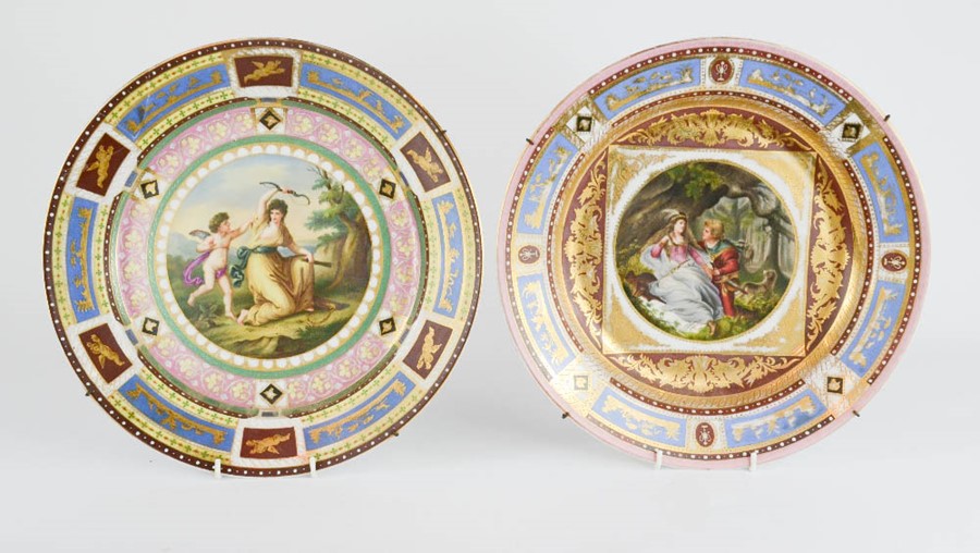 Two19th century German porcelain RPM chargers, with hand painted roundels to the centre; one