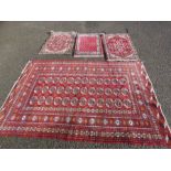 A group of Middle Eastern rugs / prayer mats.