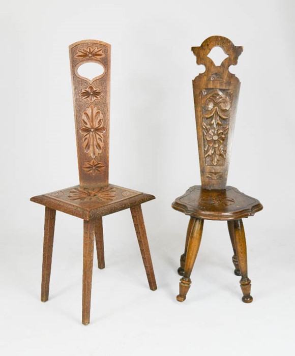 Two Welsh oak chairs, with carved splats and shaped seats, both 90cm high.