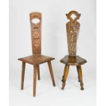 Two Welsh oak chairs, with carved splats and shaped seats, both 90cm high.