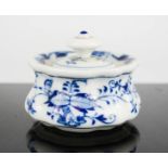 A Meissen blue and white pot and cover, decorated with flowers, 5cm high.