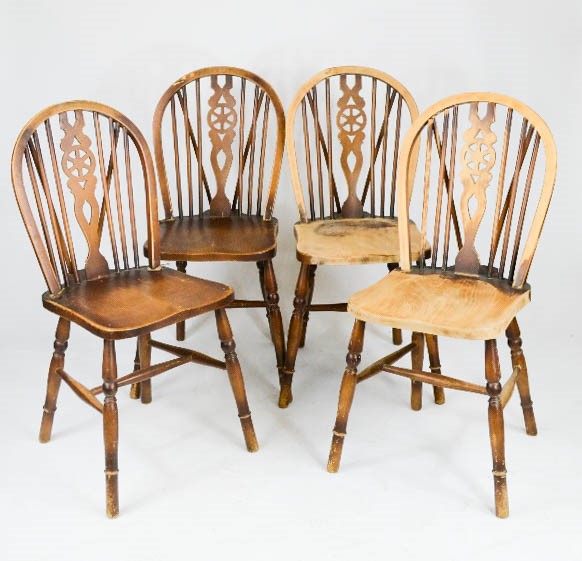 A set of four kitchen / dining chairs, with pierced splats.