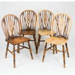 A set of four kitchen / dining chairs, with pierced splats.