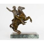 A bronze figure of Napoleon on horseback, raised on a marble base, 21cm high.