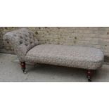 A Victorian mahogany chaise longue, in tapestry upholstery.
