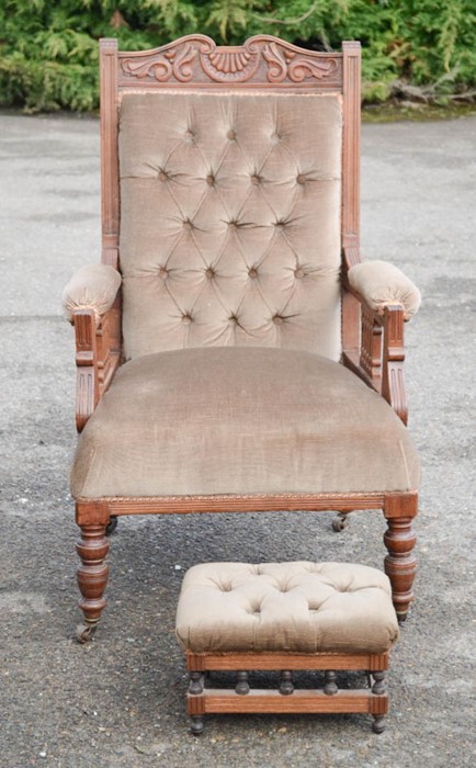 An Edwardian nursing chair with buttoned velour back and seat with matching foot stool.