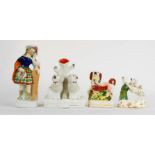 A group of 19th century Staffordshire figure groups: twin dogs posy holder, a poodle, dog and