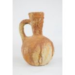 Antiquities: an excavated terracotta jug.