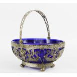 A silver basket with blue glass liner, 830 grade, possibly Dresden, 17.74toz.