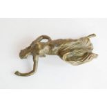 An Art Nouveau bronze lady, 11cm long.