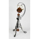 A Victorian wrought iron kettle stand with copper kettle, burner and ball weight, 90cm high.