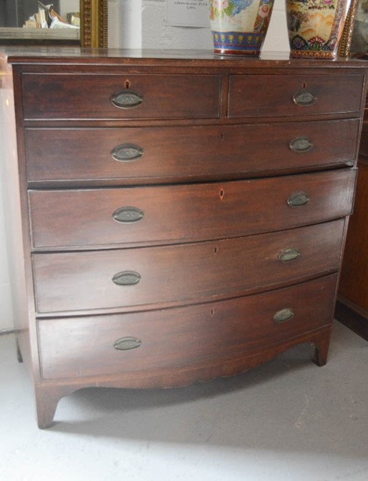 A Victorian mahogany chest of drawers, with two short above three long drawers, bow front.