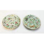 A pair of Chinese dishes, enamelled with peonies, butterflies and birds, 19cm diameter.