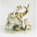 A large Lladro group depicting a woman and deer.