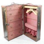 A travelling trunk with fitted interior of drawers, shoe holders and coat hanger 40 by 100cm.