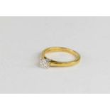 An 18ct gold and diamond solitaire ring, the brilliant cut 0.35ct diamond in a four claw setting,